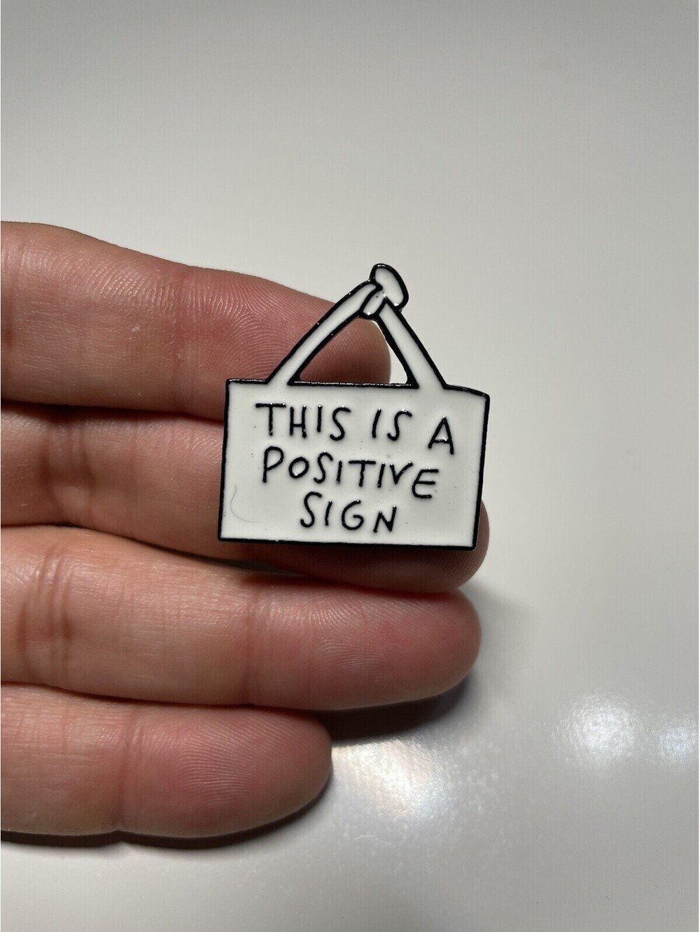 This is a Positive Sign Fun Humor Lapel Pin